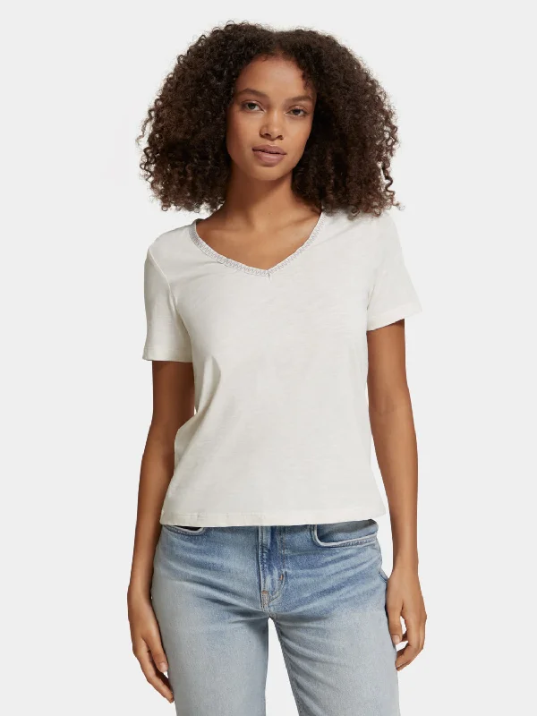 Distressed Women T Shirt with a Laid - Back AestheticShort sleeved v-neck t-shirt